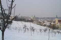 Snow covers the ground in front of Prague Castle