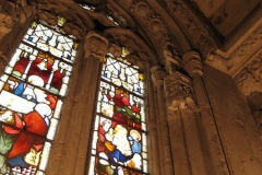 The sun shines through a stained glass window