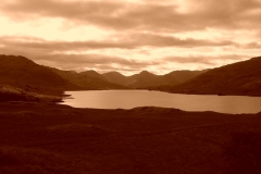 The sparkling waters of Loch Arklet in the evening sun
