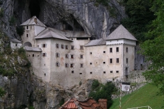Predjama castle nestles in the cliff-face