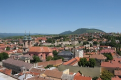 Blue sky overt the vibrant Eger roofscape