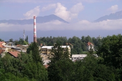 Mist hangs in the mountains over Kranj